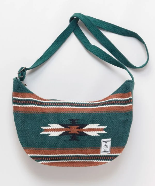 Sac bandoulière rond tissé à motif géométrique