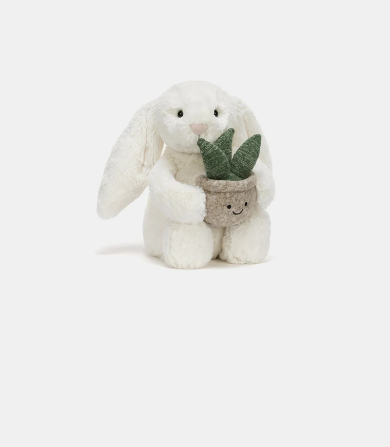 Cream bunny with plant